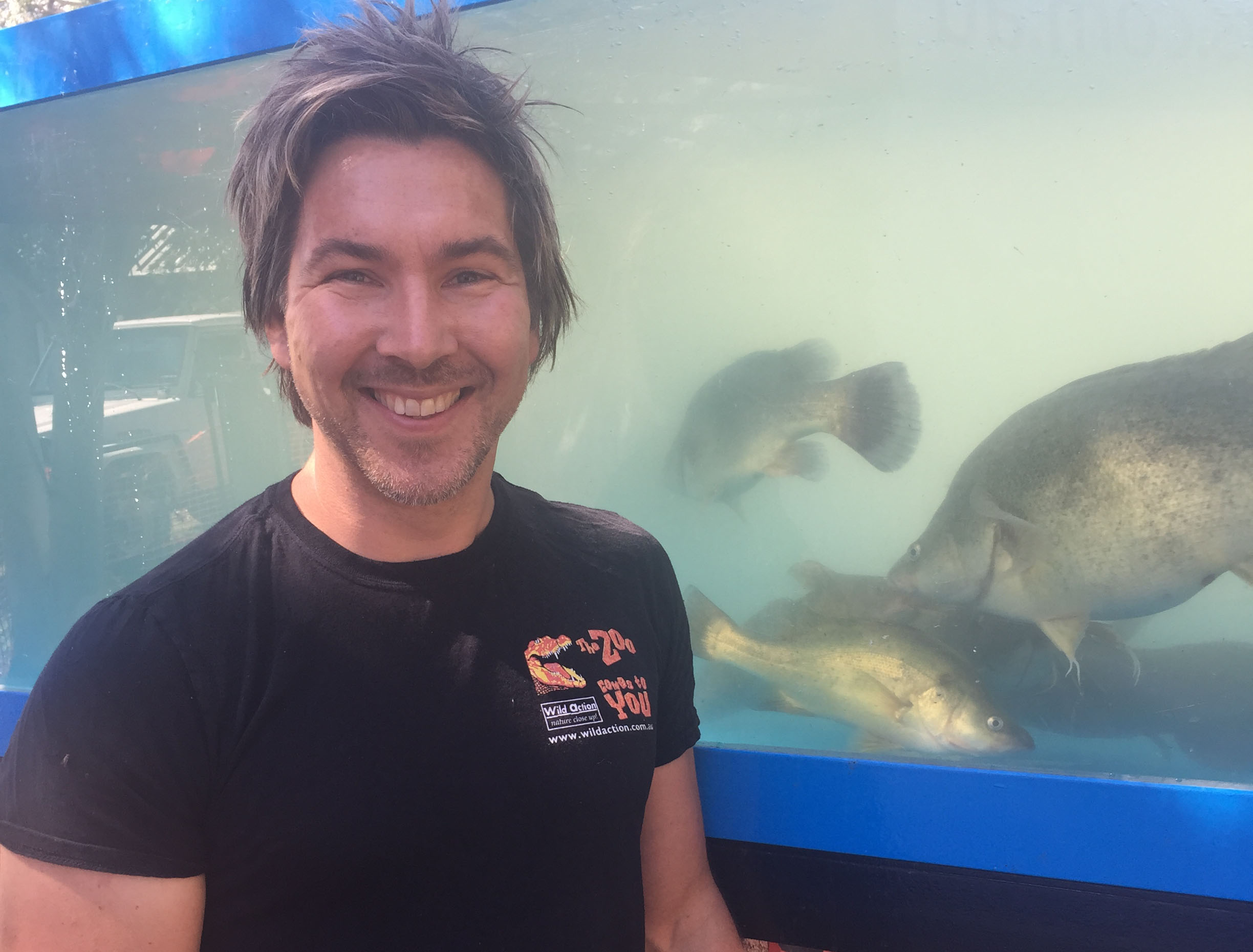 Zoologist and TV presenter Chris Humfrey, who ran river wildlife education sessions at the competition, next to a tank holding Spotted Bess, photo by Adele Rohde