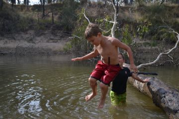 Kids jumping into the Goulburn River, Murchison, by Tony Kubeil